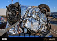 scrapped-motor-car-crushed-into-a-cube-for-recycling-BEKPK3.jpg